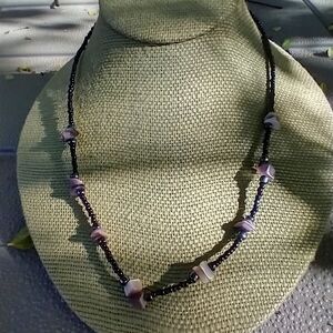 Women's black purple beaded shell necklace.